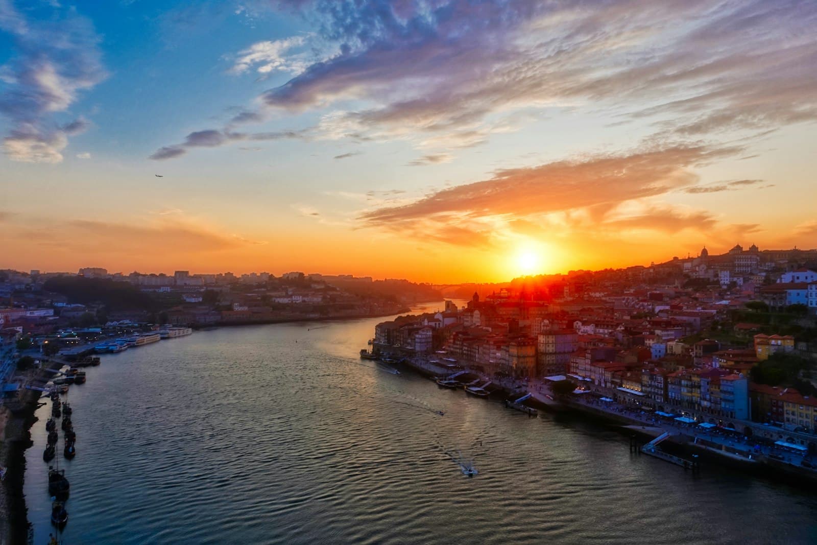 Golden-hour sunset over the Douro river and the Ribeira, Porto, Portugal